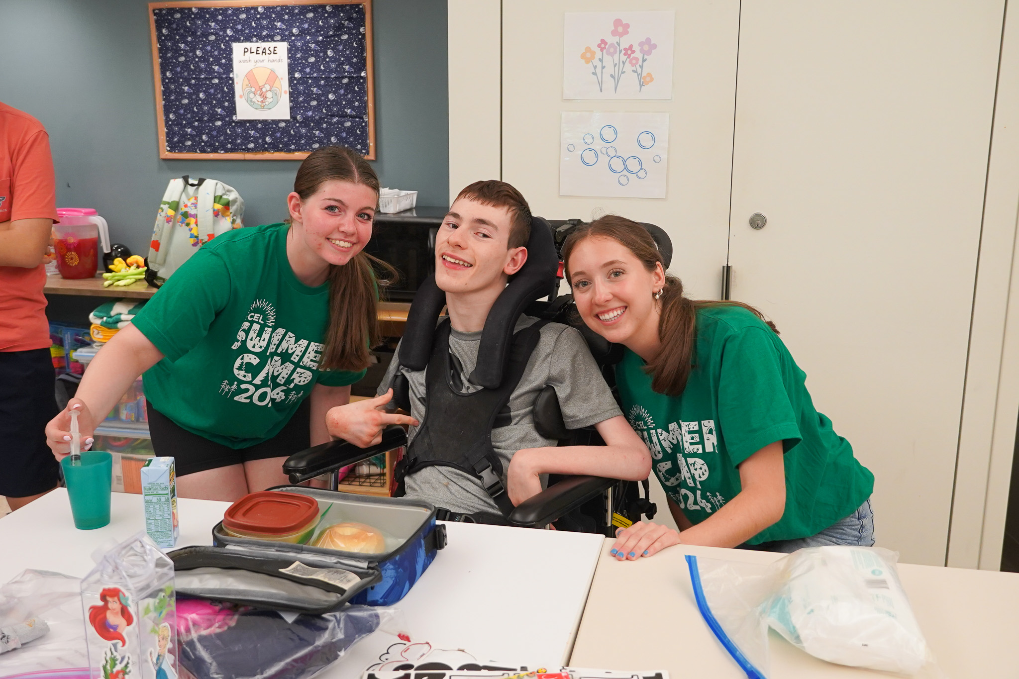 A picture of Summer Camp staff and members smiling.