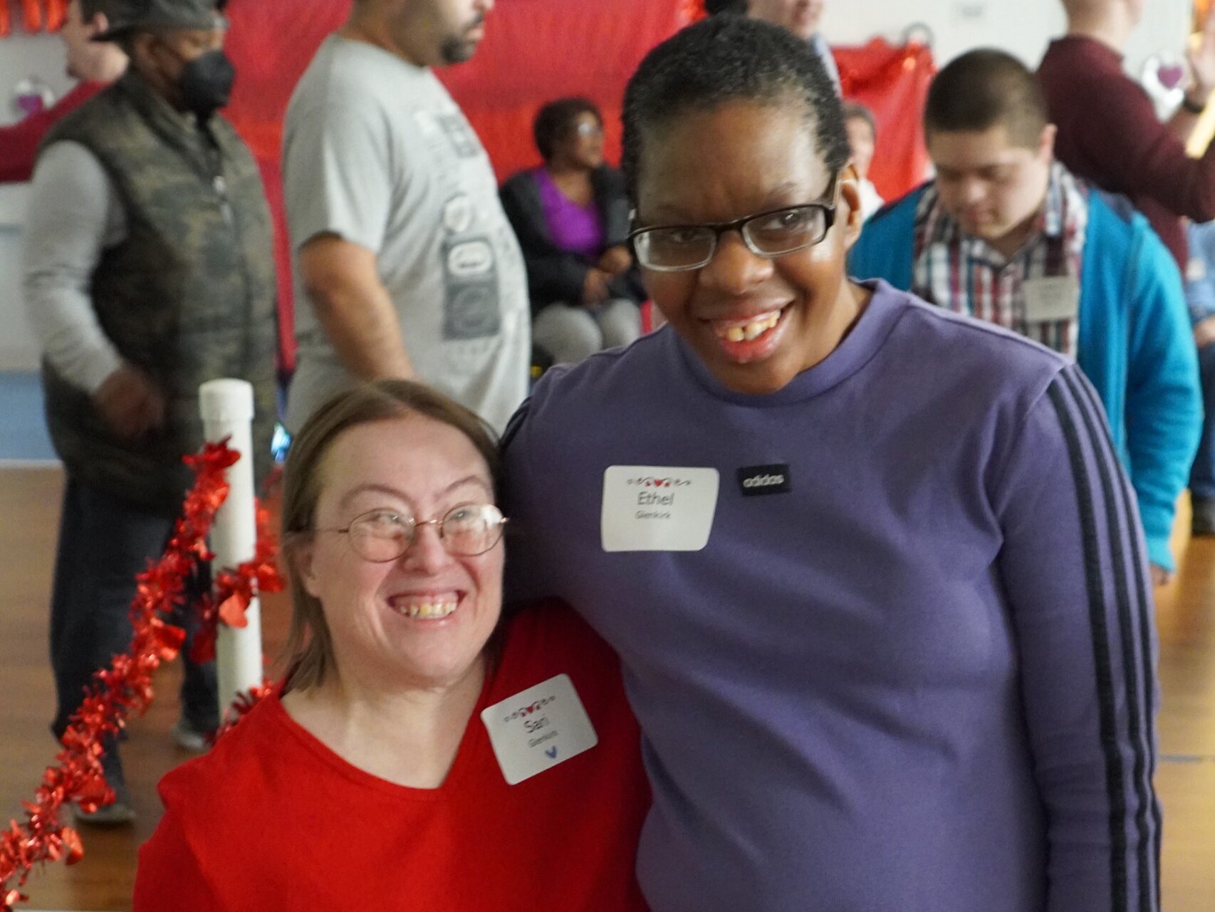 A CEL member smiling with a friend at the Sweetheart Dance.